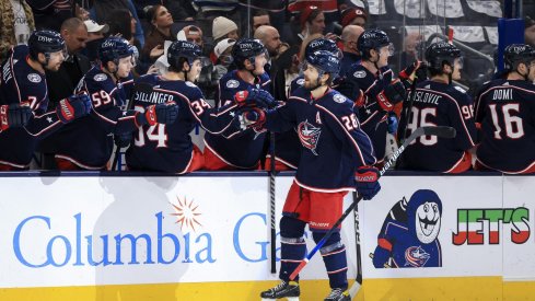 Jan 8, 2022; Columbus, Ohio, USA; Columbus Blue Jackets right wing Oliver Bjorkstrand (28) celebrates with teammates on the bench after scoring a goal against the New Jersey Devils in the first period at Nationwide Arena.