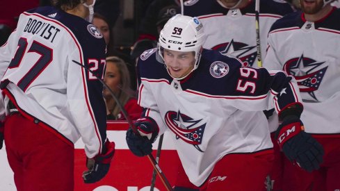 Caption: Jan 13, 2022; Raleigh, North Carolina, USA; Columbus Blue Jackets right wing Yegor Chinakhov (59) scores a goal against the Carolina Hurricanes during the second period at PNC Arena.