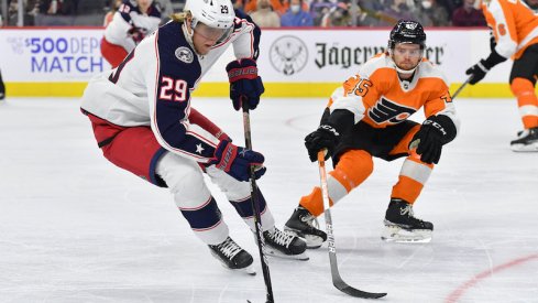 Columbus Blue Jackets's Patrik Laine is defended by Philadelphia Flyers' Cam York in the first period.