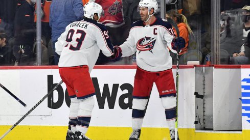 Columbus Blue Jackets' Boone Jenner and Jake Voracek celebrate their win at the Philadelphia Flyers on Thursday.