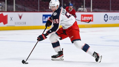 Columbus Blue Jackets' Yegor Chinakhov skates with the puck against the Montreal Canadiens at Bell Centre.