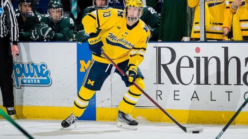 Columbus Blue Jackets prospect Kent Johnson playing a hockey game for University of Michigan.