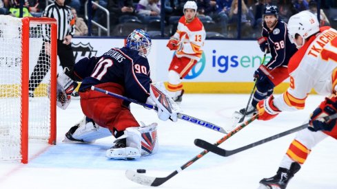 Elvis Merzlikins faced 62 shots in Columbus' first game this season against Calgary.