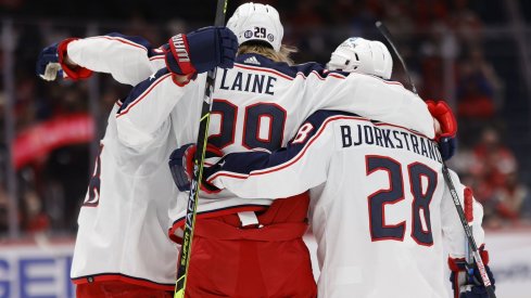 Feb 8, 2022; Washington, District of Columbia, USA; Columbus Blue Jackets left wing Patrik Laine (29) celebrates with teammates after scoring a goal against the Washington Capitals during the second period at Capital One Arena.