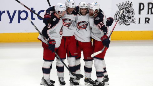 Columbus Blue Jackets's Patrik Laine celebrates his game-winning goal with teammates against the Montreal Canadiens at Bell Centre.