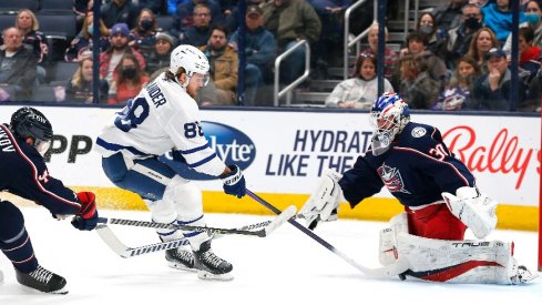  The Columbus Blue Jackets' J-F Berube makes a pad save against the Toronto Maple Leafs' William Nylander in the second period at Nationwide Arena