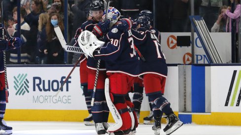 Columbus Blue Jackets' J-F Berube and teammates celebrate their win against the Toronto Maple Leafs at Nationwide Arena.