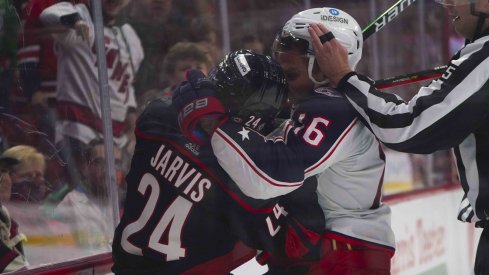 Feb 25, 2022; Raleigh, North Carolina, USA; Columbus Blue Jackets center Max Domi (16) and Carolina Hurricanes center Seth Jarvis (24) battle during the first period at PNC Arena.