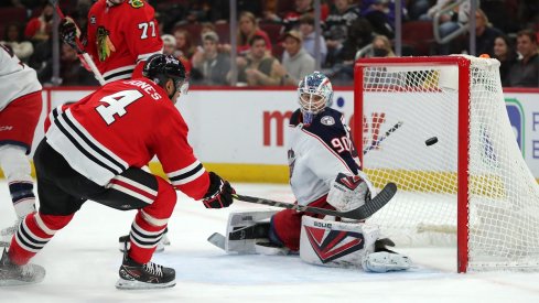 Seth Jones shoots on Columbus Blue Jackets goaltender Elvis Merzlikins