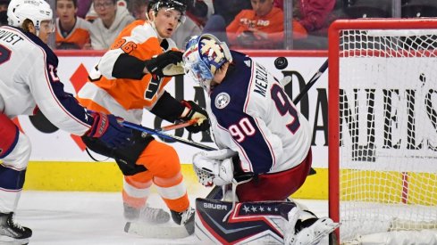 Columbus Blue Jackets goaltender Elvis Merzlikins (90) makes a save against Philadelphia Flyers left wing Joel Farabee (86) during the second period at Wells Fargo Center.