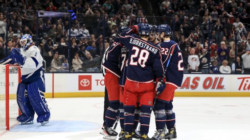 The Columbus Blue Jackets celebrate a third period goal against the Tampa Bay Lightning at Nationwide Arena.