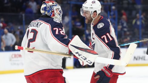 Columbus Blue Jackets goaltender Sergei Bobrovsky and left winger Nick Foligno celebrate as they beat the Tampa Bay Lightning in game one of the first round of the 2019 Stanley Cup Playoffs.