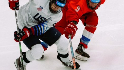 Danil Grigoriev RUS challenges Cutter Gauthier USA as he controls the puck during the RUS v USA Final of the Ice Hockey 6-Teams Men's competition at Vaudoise Arena. The Winter Youth Olympic Games.