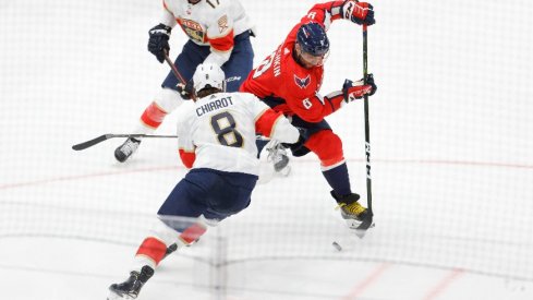 Washington Capitals left wing Alex Ovechkin skates with the puck around Florida Panthers defenseman Ben Chiarot in the third period in game three of the first round of the 2022 Stanley Cup Playoffs.