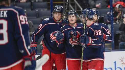 Columbus Blue Jackets' Patrik Laine celebrates his goal with teammates in the third period against the Toronto Maple Leafs at Nationwide Arena.