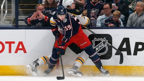 Columbus Blue Jackets' right winger Yegor Chinakhov checks Boston Bruins defenseman Charlie McAvoy during the first period at Nationwide Arena.