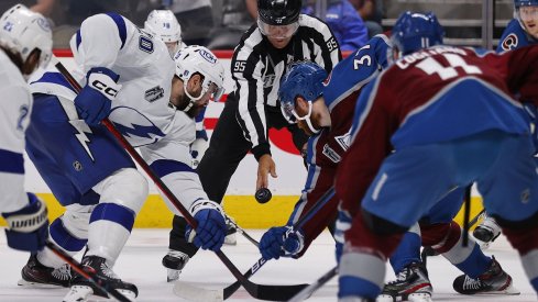 The Tampa Bay Lightning and Colorado Avalanche left wing face off during game two of the 2022 Stanley Cup Final