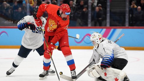 Kirill Dolzhenkov of Russia and Dylan Silverstein of USA battle for the puck during the Men's 6-Team Ice Hockey Tournament Finals Gold Medal Game between Russian Federation and United States on day 13 of the Lausanne 2020 Winter Youth Olympics at Lausanne Vaudoise Arena on January 22, 2020 in Lausanne, Switzerland.