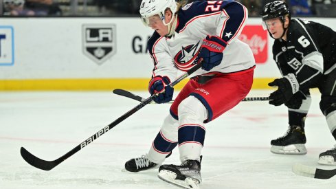 Columbus Blue Jackets' Patrik Laine skates the puck past Los Angeles Kings defenseman Olli Maatta in the third period at Crypto.com Arena.