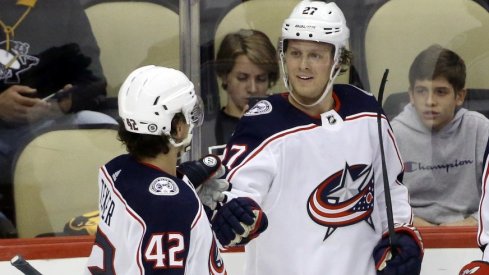 Columbus Blue Jackets defenseman Adad Boqvist celebrates with center Alexandre Texier after scoring a goal against the Pittsburgh Penguins during the third period at PPG Paints Arena.