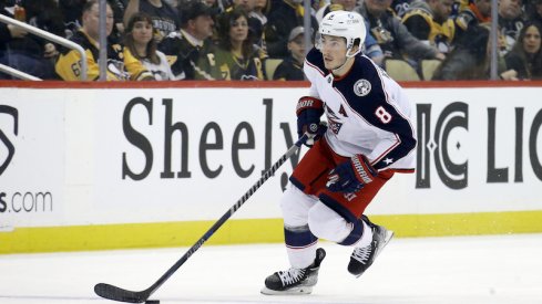 Columbus Blue Jackets' Zach Werenski skates with the puck against the Pittsburgh Penguins during the first period at PPG Paints Arena.