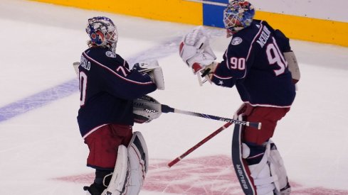 Columbus Blue Jackets goaltender Joonas Korpisalo  heads for the bench as he is replaced by goaltender Elvis Merzlikins during the second period against the Toronto Maple Leafs in the Eastern conference play-in game.