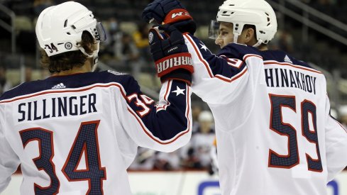 Yegor Chinakhov celebrates with Cole Sillinger after scoring a goal 