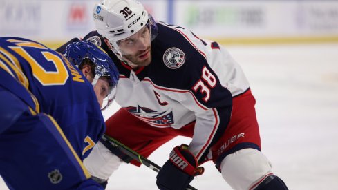 Buffalo Sabres' Tage Thompson and Columbus Blue Jackets' Boone Jenner wait for the face-off during the first period at KeyBank Center.