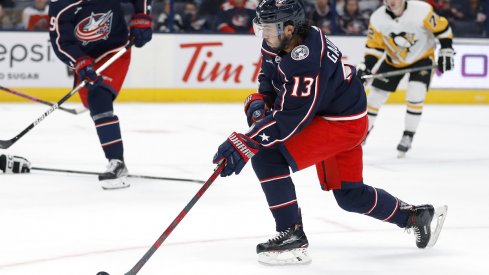 Johnny Gaudreau controls the puck against the Pittsburgh Penguins in his preseason debut