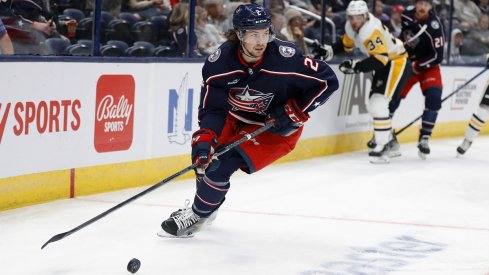 Andrew Peeke looks to pass the puck against the Pittsburgh Penguins at Nationwide Arena