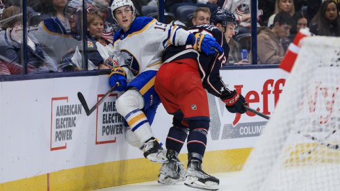 Columbus Blue Jackets' Carson Meyer checks Buffalo Sabres' Peyton Krebs along the boards in the third period at Nationwide Arena.