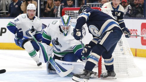 Vancouver Canucks goalie Spencer Martin makes a save against Columbus Blue Jackets defenseman Nick Blankenburg during the second period at Nationwide Arena.