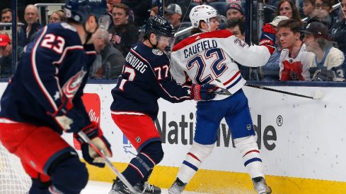 Columbus Blue Jackets defenseman Nick Blankenburg checks Montreal Canadiens right wing Cole Caufield during the first period at Nationwide Arena.