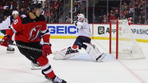 New Jersey Devils' John Marino scores a goal on Columbus Blue Jackets' Elvis Merzlikins during the second period at Prudential Center.