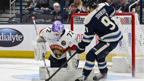 Florida Panthers' Sergei Bobrovsky makes a save on Columbus Blue Jackets' Kent Johnson in the third period at Nationwide Arena.