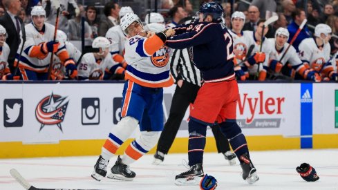 New York Islanders left wing Anders Lee fights with Columbus Blue Jackets right wing Mathieu Olivier in the second period at Nationwide Arena.