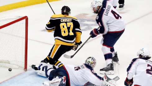 Pittsburgh Penguins center Sidney Crosby scores a goal past Columbus Blue Jackets goaltender Elvis Merzlikins during the second period at PPG Paints Arena.