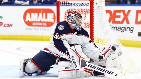 Columbus Blue Jackets' Daniil Tarasov makes a save against the Tampa Bay Lightning during the third period at Amalie Arena.