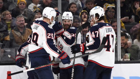 Columbus Blue Jackets' Boone Jenner celebrates his goal with his teammates during the second period against the Boston Bruins at TD Garden.