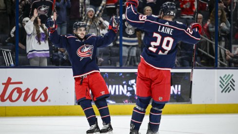 Columbus Blue Jackets Johnny Gaudreau' celebrates his game winning goal against the Los Angeles Kings with Columbus Blue Jackets' Patrik Laine in overtime at Nationwide Arena.