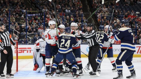 Columbus Blue Jackets' Mathieu Olivier scrums with members of the Washington Capitals in the second period at Nationwide Arena.