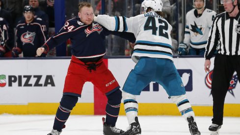 Columbus Blue Jackets' Mathieu Olivier and San Jose Sharks' Jonah Gadjovich fight during the second period at Nationwide Arena.