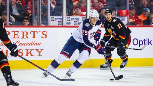 Patrik Laine skates with the puck in the Blue Jackets' contest against the Calgary Flames.