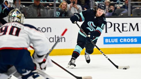 Seattle Kraken' Jared McCann shoots the puck against the Columbus Blue Jackets during the first period at Climate Pledge Arena.