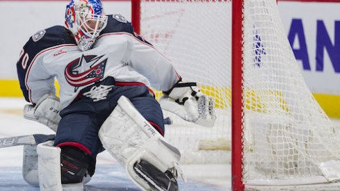 Joonas Korpisalo makes a save in the Blue Jackets' game against the Vancouver Canucks.