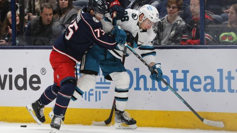 Columbus Blue Jackets' Tim Berni checks San Jose Sharks' Timo Meier during the second period at Nationwide Arena.