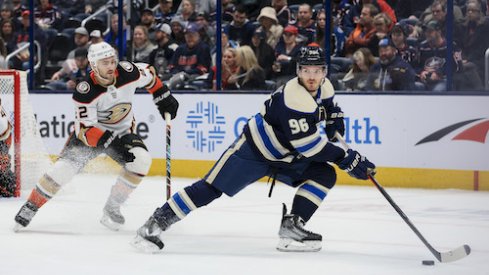 Jack Roslovic skates with the puck in the Ducks vs. Blue Jackets game.