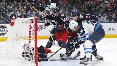 Joonas Korpisalo makes a save in the Blue Jackets vs. Jets game.