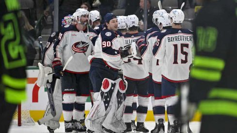 Columbus Blue Jackets' Elvis Merzlikins and Blue Jackets celebrate the win over the Dallas Stars at the American Airlines Center.