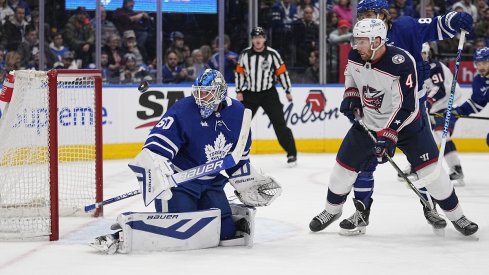Vladislav Gavrikov looks for the puck against the Toronto Maple Leafs